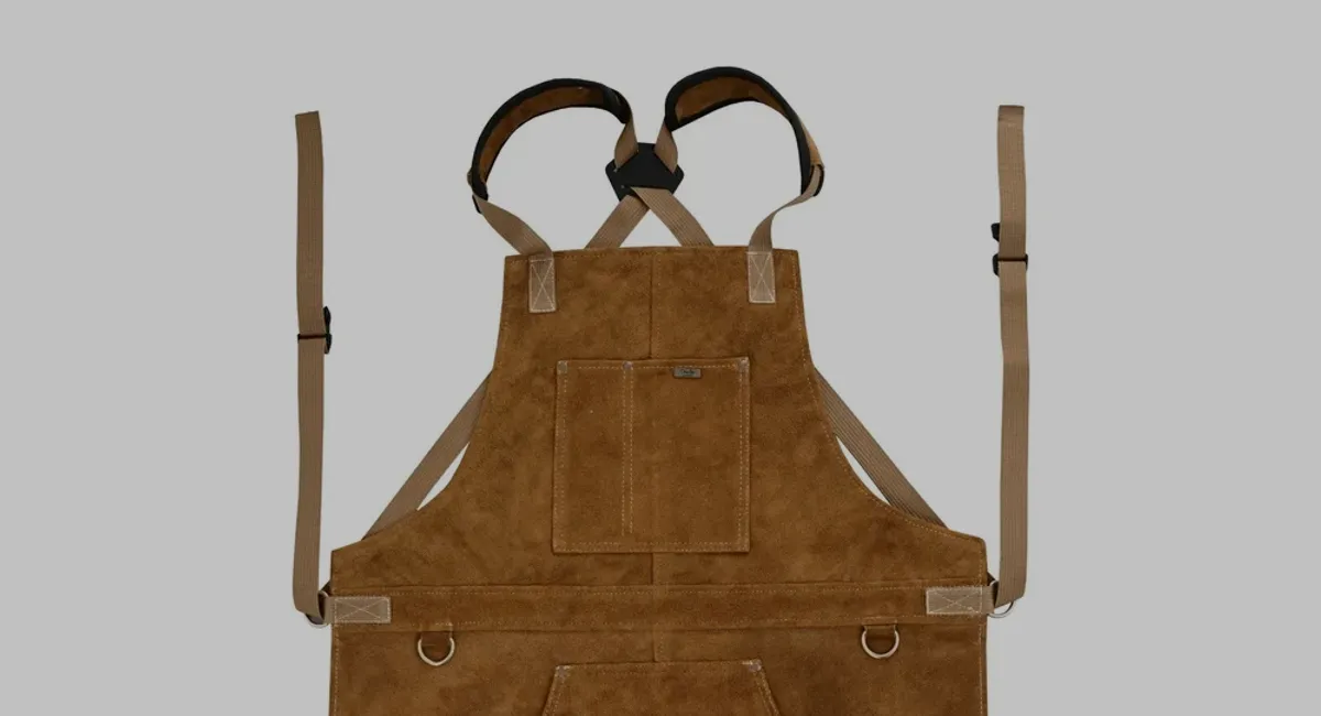 Close detail of leather apron craftsmanship and pockets
